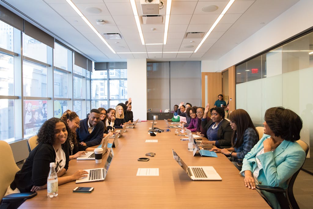 A diverse group of professionals engaging in a productive meeting around a conference table.